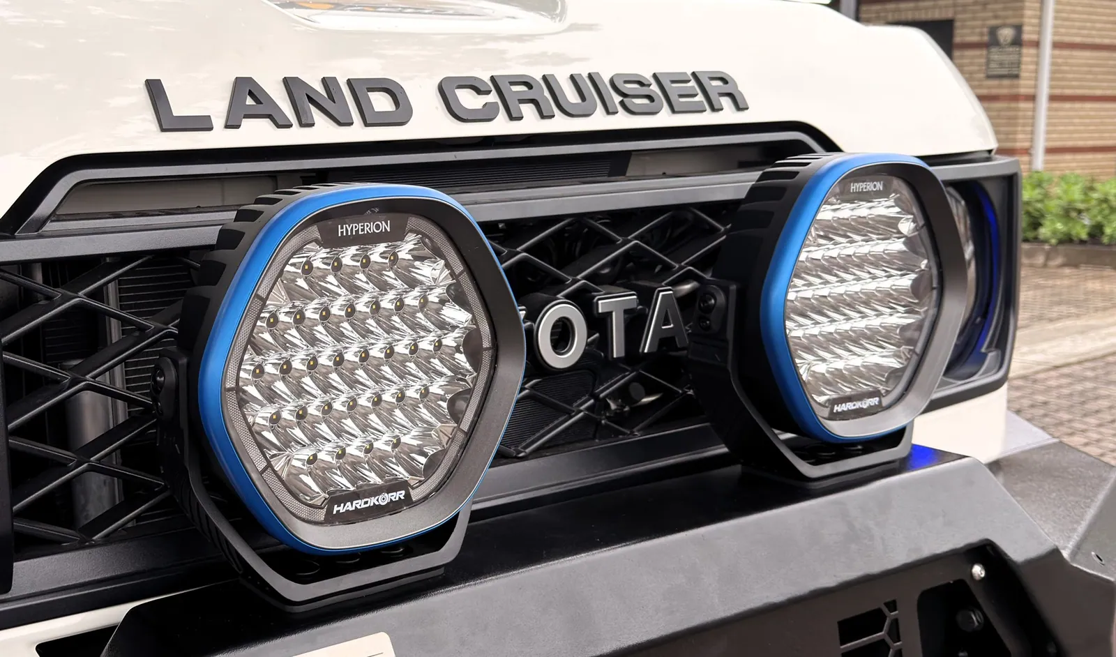 Hardkorr Hyperion LED driving lights with blue bezels on the front bar — King Cruiser — JMACX Coil-Converted Land Cruiser 79, fitted by Venture 4x4 in Nelspruit