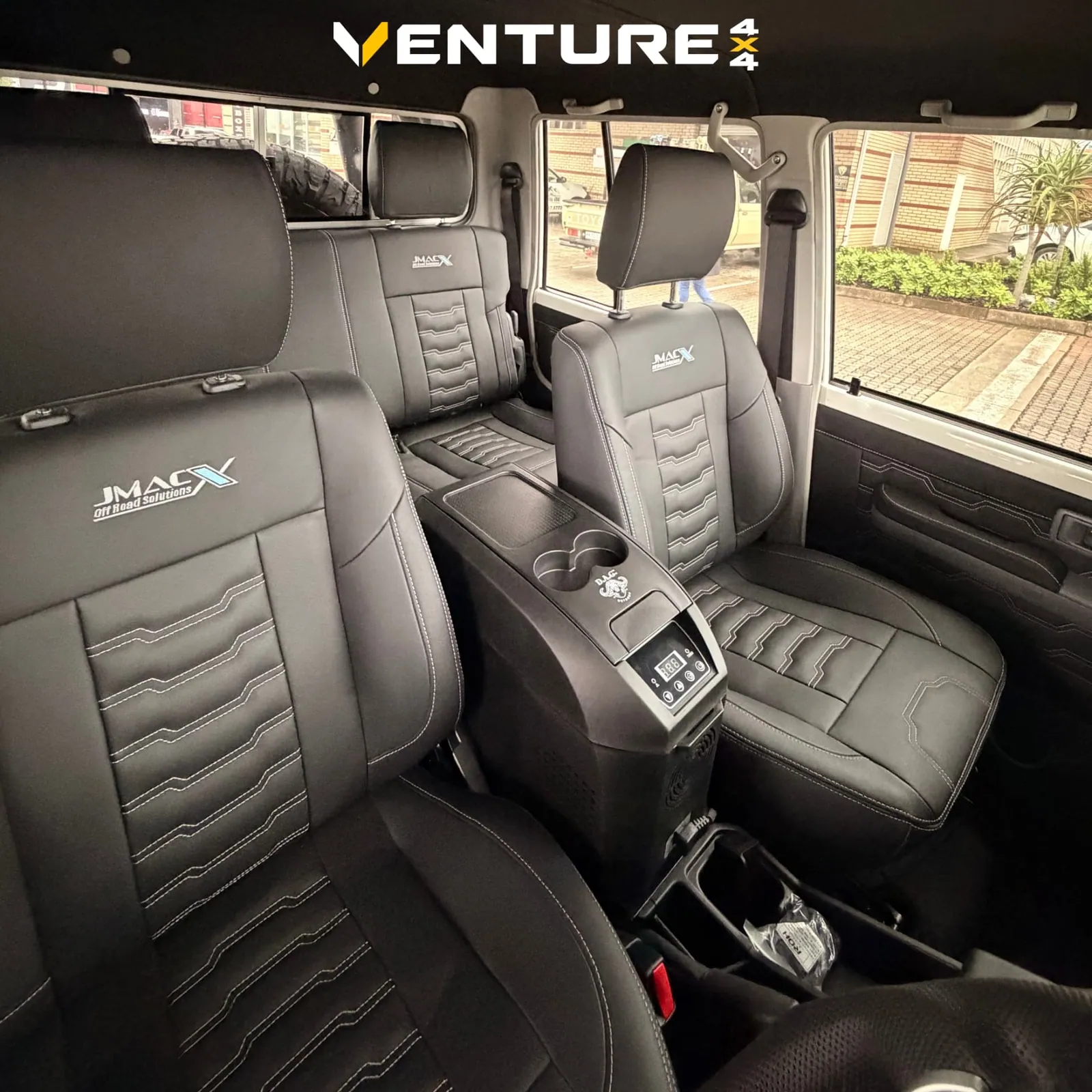 JMACX leather interior with fridge console in a Land Cruiser 79