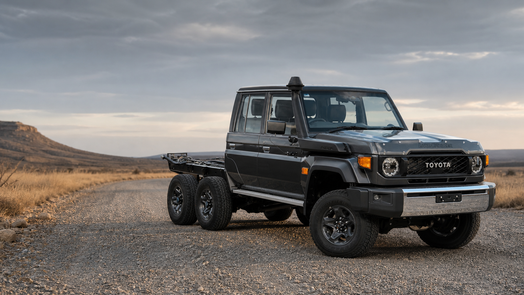 JMACX 6x6 Land Cruiser 79 cab chassis on a gravel road