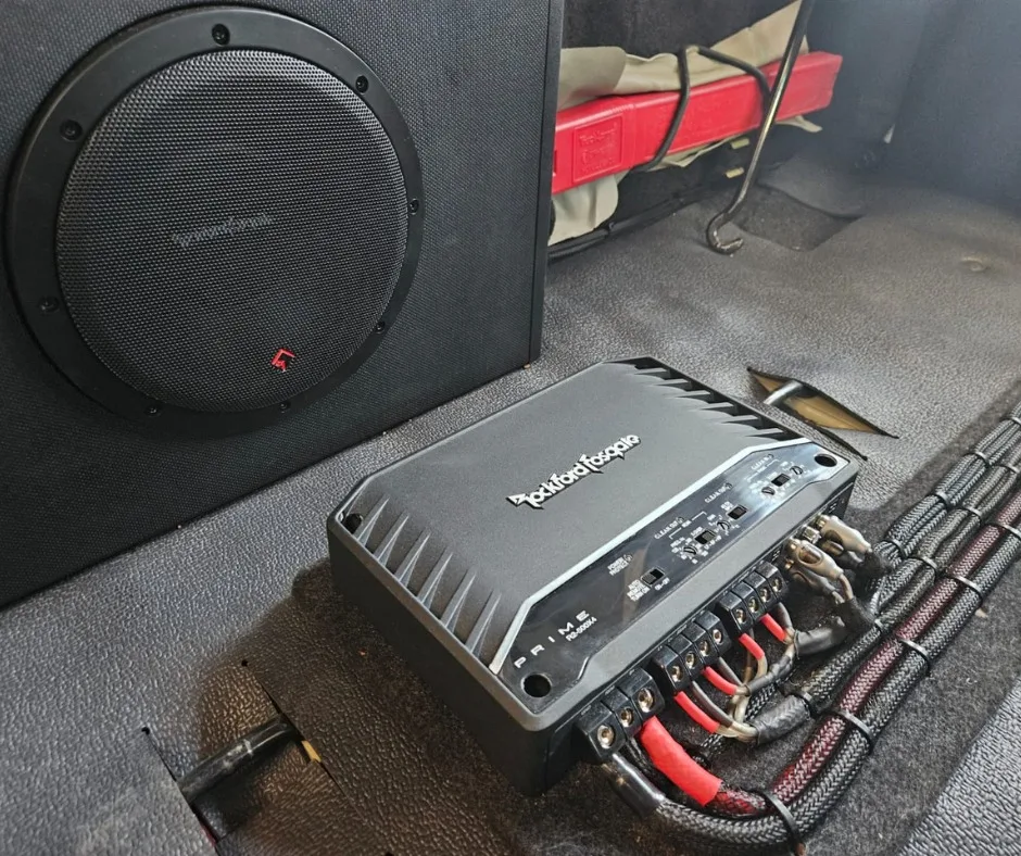 Rockford Fosgate amplifier and subwoofer installation in a Land Cruiser